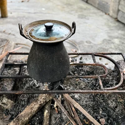 Photo of a pot on woodfired stove