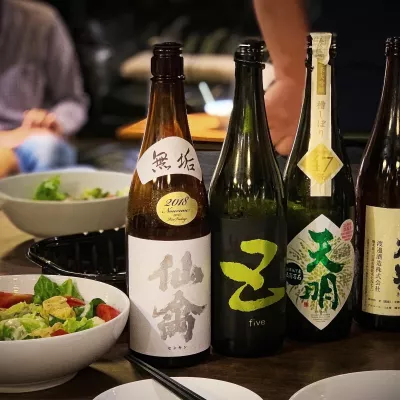 Bottles of sake atop a dinner table
