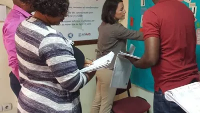 Researchers map concepts on a board in the Democratic Republic of Congo